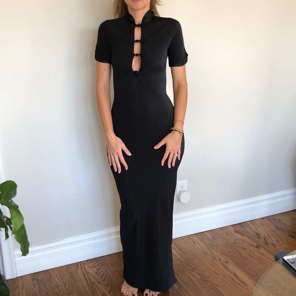 Asian-inspired fitted black cocktail dress.